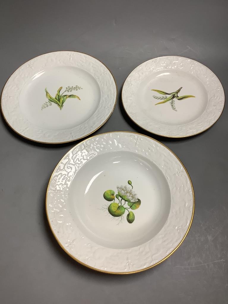 An early 19th century Spode matched part dinner service of botanical design